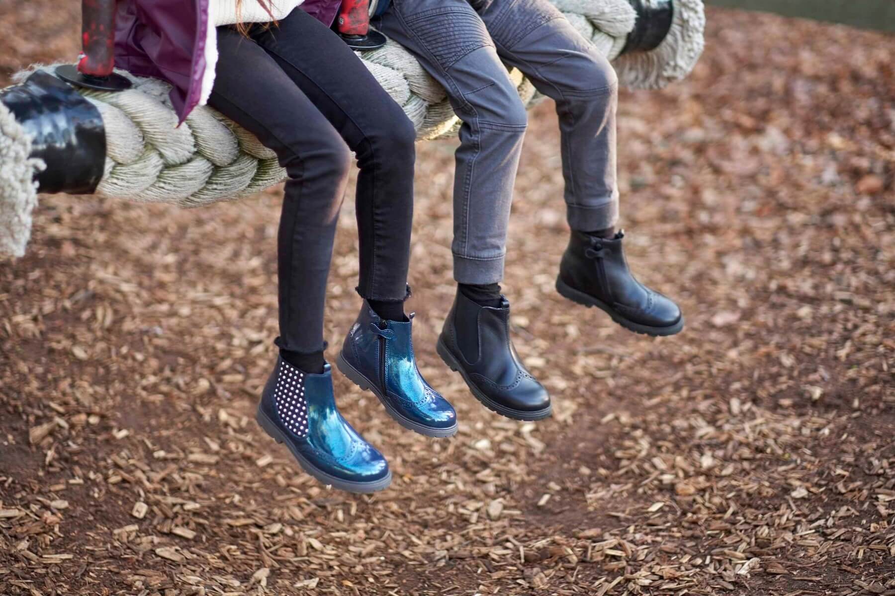 Girl and boy on rope swing