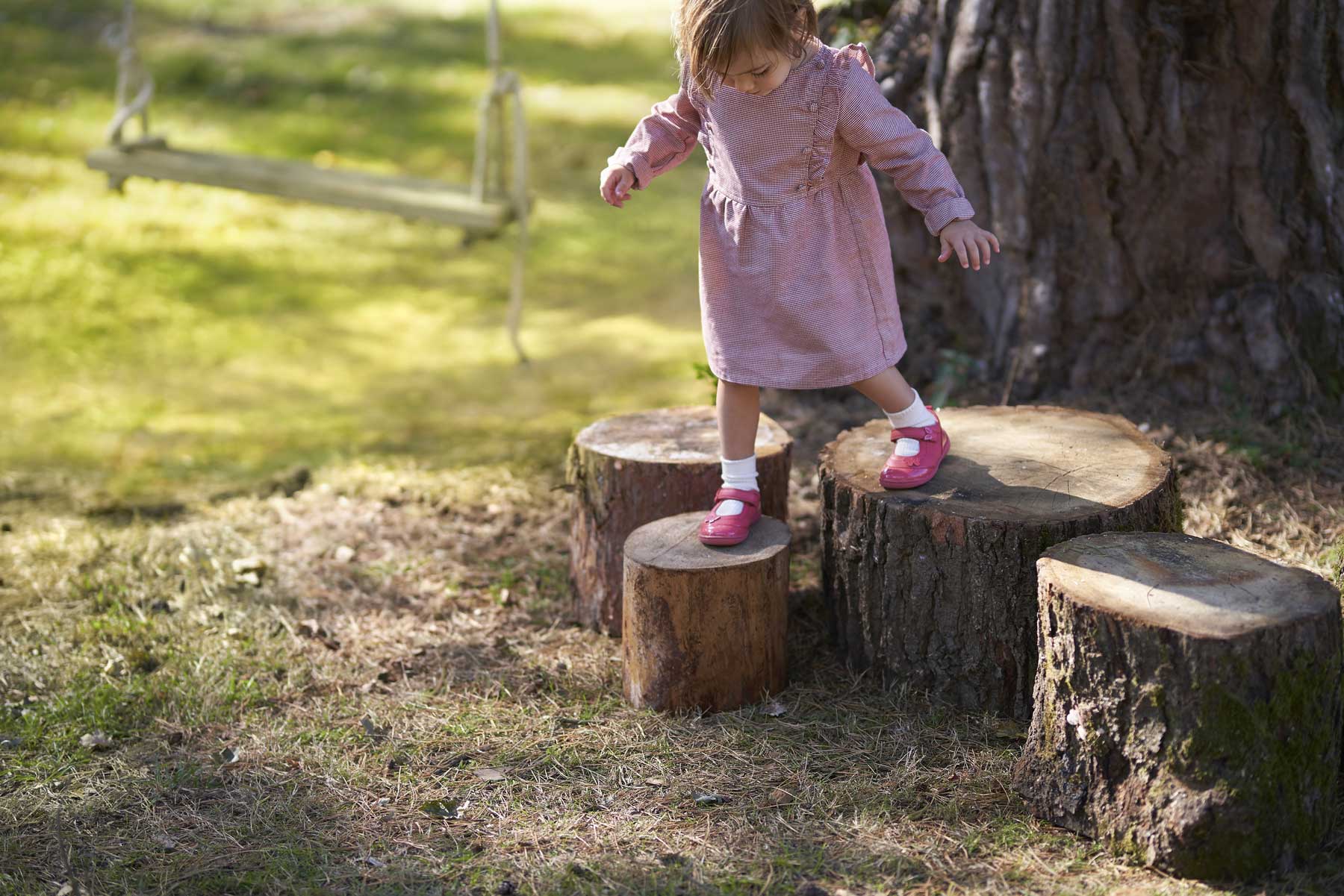 Girl on Logs