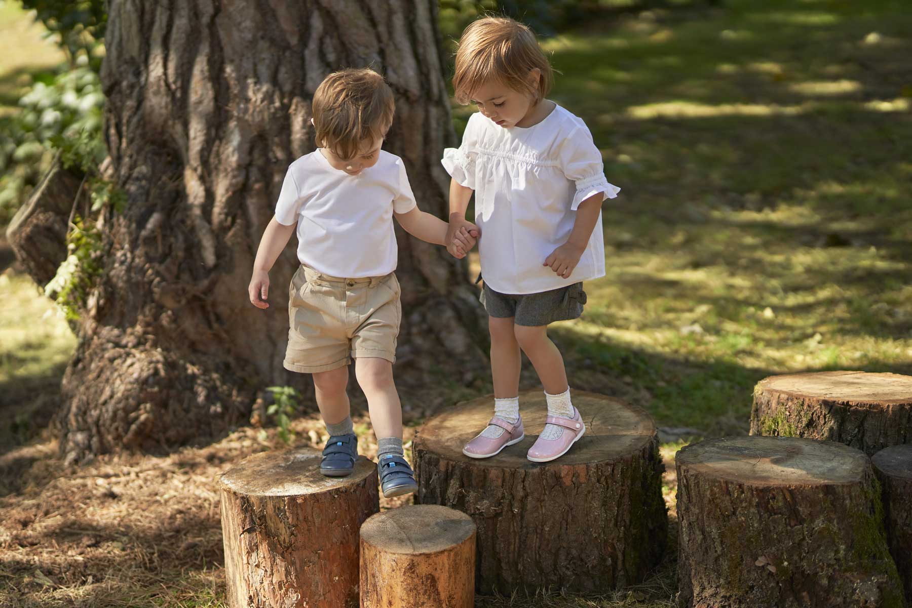 Girl and Boy on Logs